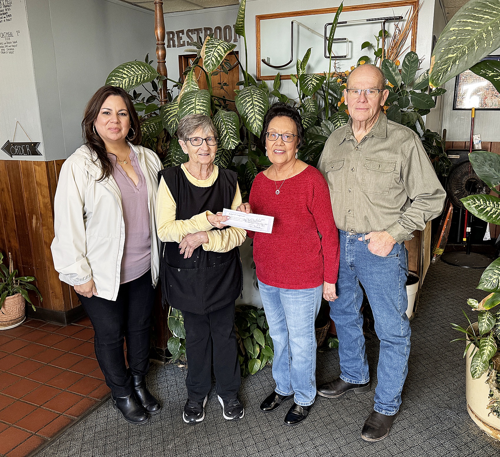 Lita and Ray Talbert, to the right, are awarded their honorary winnings. From left to right, Tina Fernandez Hugoton Chamber Director, Lana Slocum owner of The Jet where their names were originally drawn and Lita and Ray. Congratulations Ray and Lita!!!