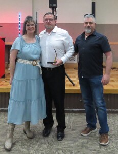 Tim Singer receives the Citizen of the Year. Pictured are Kristi and Tim Singer and Todd Hewitt.
