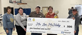 Mr. Les McNally is pictured above holding his check for $500. He also received an engraved plaque and is one of the Regional winners in the 2024 Kansas State Gold Owl Award. He 
received the check at the ninety-sixth Kansas FFA Convention.