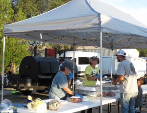 Free hamburgers and hot dogs are handed out during the evening at the annual Community Night Out Sunday.