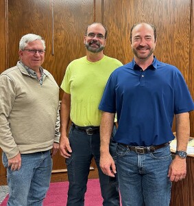 Randy Moore, center, is retiring after twelve and a half years with Stevens County Road and Bridge. His last day is Thursday. Pictured with Randy are Tony Martin, Road and Bridge, at left, and Tron Stegman, Commissioner, at right.