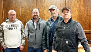 Stevens County employees are honored for their years of service during Commissioners meeting. From the left are Chad Bennett, 25 years; Tron Stegman, Commissioner; Roger Beesley, 30 years and Robert Rich, 20 years.