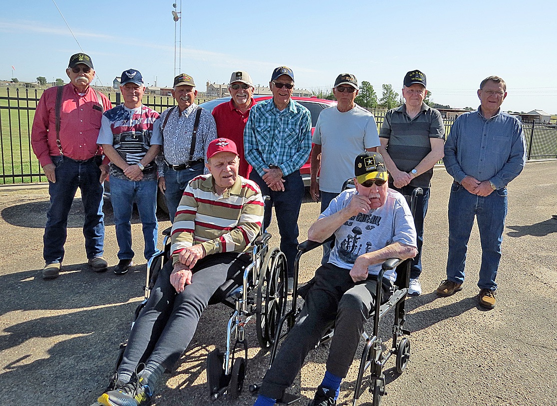 Veterans gather during the Memorial Day 
services Monday morning. Pictured in the back from left to right are Bob Passmore, 
Gary Hinkle, Jan Keith, Clayton Gerrond, 
Dick Hoskinson, Chuck Simmons, Claude Rich and Frank Furr. In front are Wayne Hoskinson and Mick Prine.