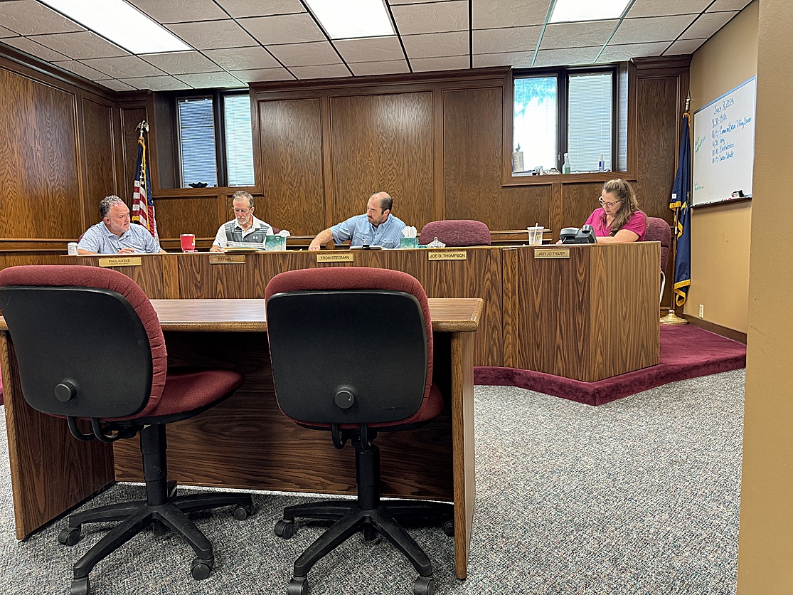 Attending to business Monday at the Commissioner’s meeting are, left to right , County Attorney Paul Kitzke, Commissioner Pat Hall, Commissioner Tron Stegman and County Clerk Amy Jo Tharp.