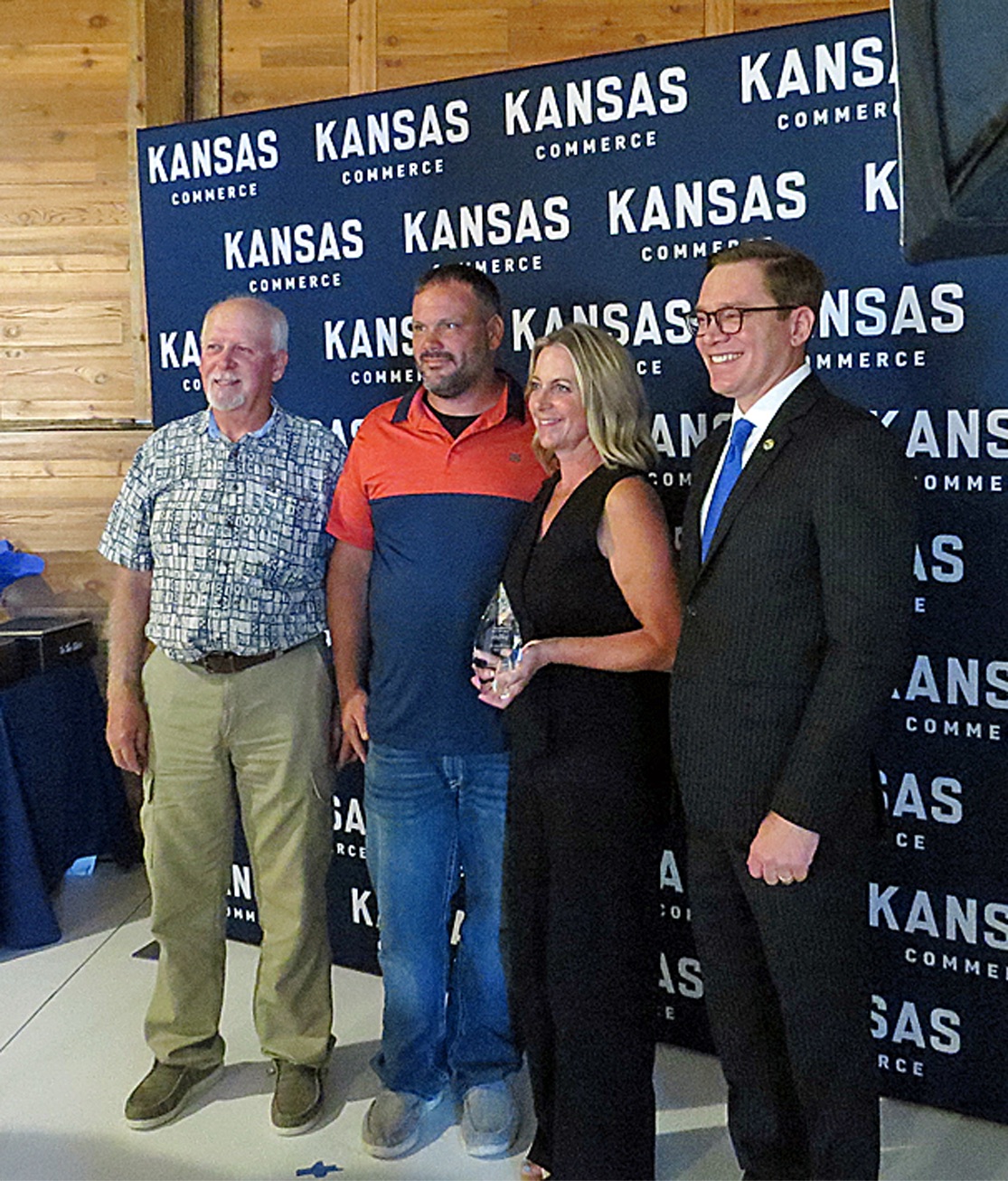 The Community Impact Award goes to Brandi Lahey, The Wild Sage Ranch, LLC. Pictured with Brandi are Steve Morisse, Evan Lahey, Brandi and Lt. Governor  and Secretary of Commerce David Toland.