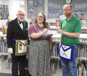 The Hugoton Masonic Lodge is a proud sponsor of the Stevens County Library 2025 Summer Library Program. Pictured:  David Eckert, Stacey Strickland and Bryan Noyes.